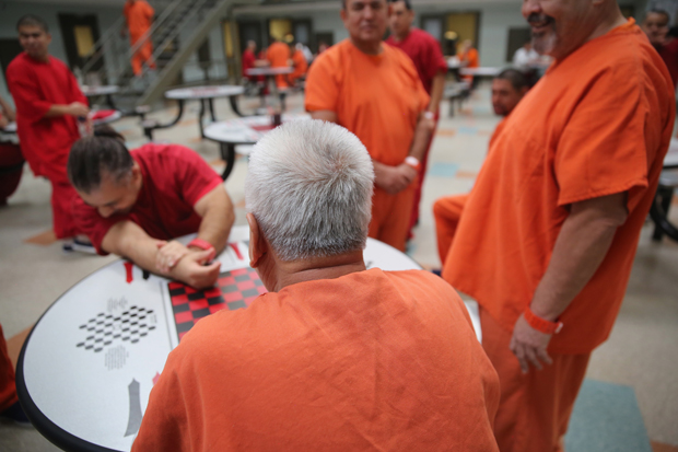Detainees talk while in a general population block at the Adelanto Detention Facility on November 15, 2013 in Adelanto, California.