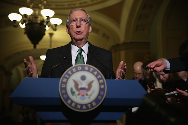 Sen. Mitch McConnell (R-KY) speaks to members of the media after the weekly Senate Republican Policy Luncheon December 16, 2014 on Capitol Hill in Washington, DC. 