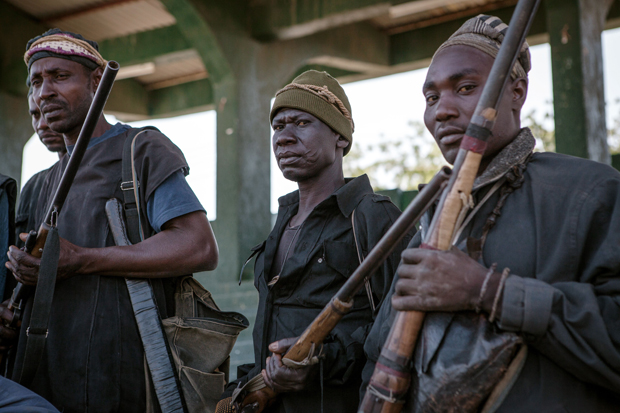 A band of hunters pose in Yola, state capital of Adamawa, on December 4, 2014 after taking part in an operation against Nigerian Islamist extremist group Boko Haram. Military and vigilantes forces acknowledge the crucial support of hunters in the fight against Boko Haram.