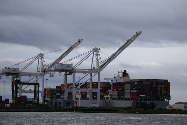A container ship sits idle at the Port of Oakland on February 6, 2015 in Oakland, California. Pacific Maritime Association announced that terminal operators at 29 West Coast ports will be shutting down cargo operations amidst long labor negotiations with the International Longshore and Warehouse Union.