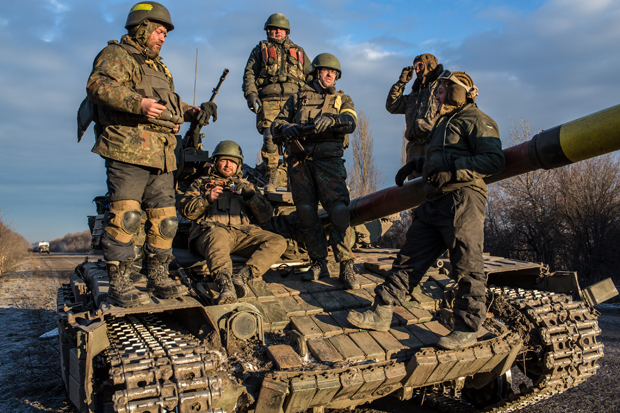 Ukrainian soldiers who left Debaltseve yesterday prepare to return to support the further withdrawal of troops Feb. 19 in Artemivsk, Ukraine.