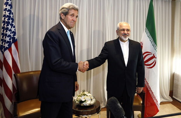 Iranian Foreign Minister Mohammad Javad Zarif shakes handswith U.S. State Secretary John Kerry on Jan. 14 in Geneva. Kerry was preparing Feb. 22 to sit down for two days of talks with Zarif, whose country denies its nuclear program has military objectives. 