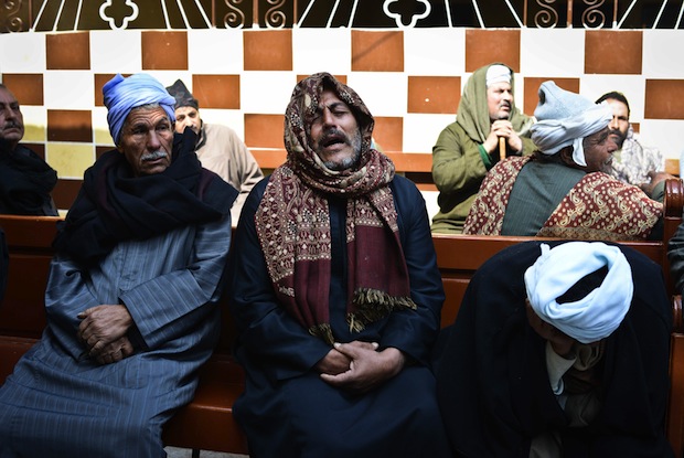 Relatives of Egyptian Coptic Christians purportedly murdered by Islamic State (IS) group militants in Libya react after hearing the news on February 16, 2015 in the village of Al-Awar in Egypt's southern province of Minya