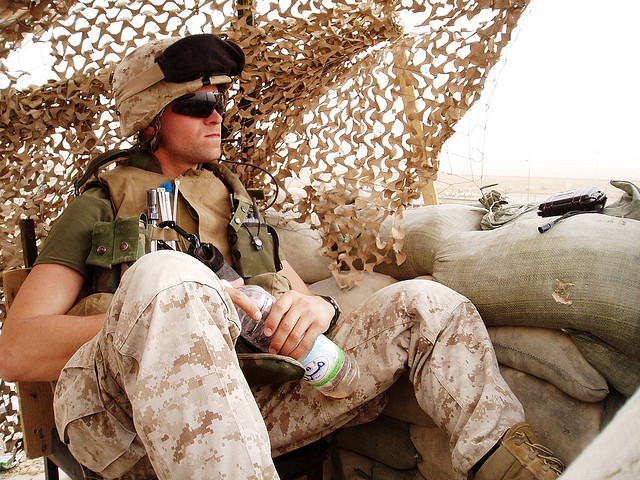 A Marine sits atop an operating base in Iraq.  

