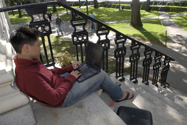 This file photo shows Freshman Chris Chen working on his notebook computer on the campus of Harvard University in Cambridge, Massachusetts.