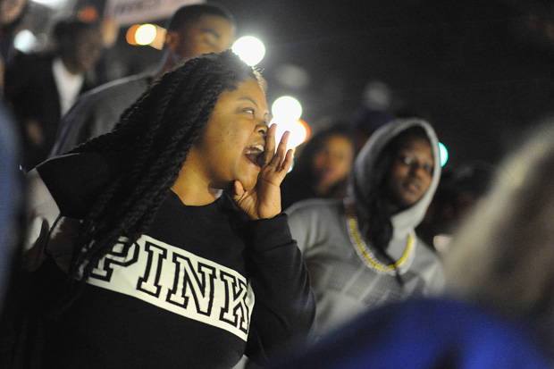 Protesters demonstrate outside the Ferguson Police Department on March 11 in Ferguson, Missouri. 