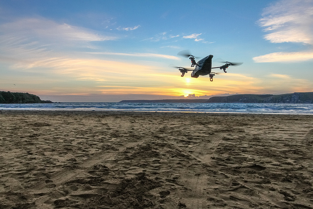 A drone flies over a beach in England.