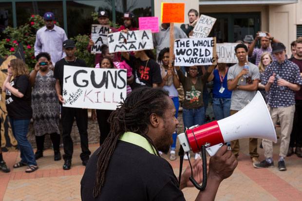 People participate in a rally April 8 outside North Charleston, Carolina's city hall to protest the death of Walter Scott, who was killed by city police in a shooting.