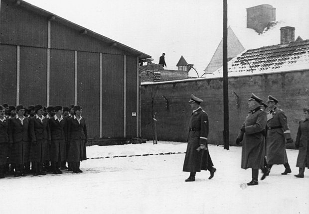 SS leader Heinrich Himmler, accompanied by Max Koegel, inspects women guards at the Ravensbrück Concentration Camp in Germany.
