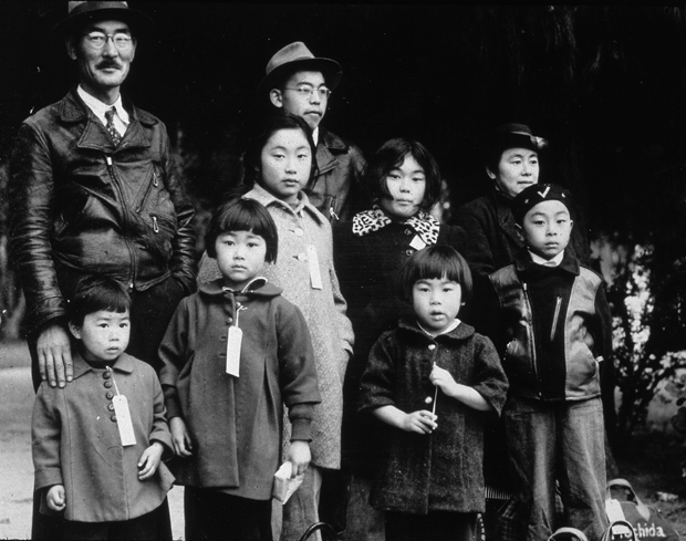 Members of the Japanese-American Mochida family in Hayward, California, awaiting re-location to a camp.