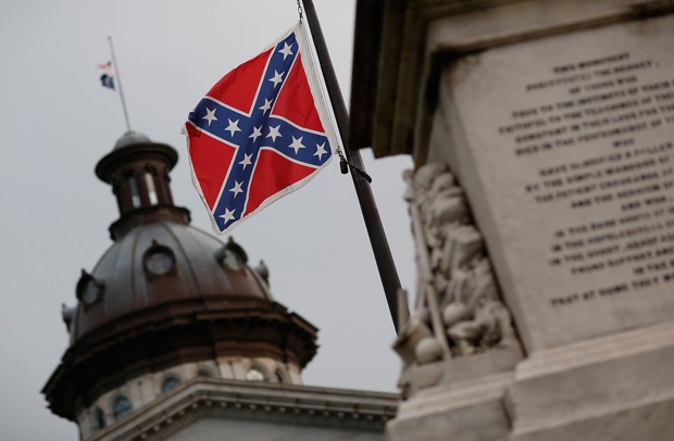 The Confederate flag flies on the grounds of South Carolina's capitol June 23, one day after South Carolina Gov. Nikki Haley announced that she will call for the Confederate flag to be removed.