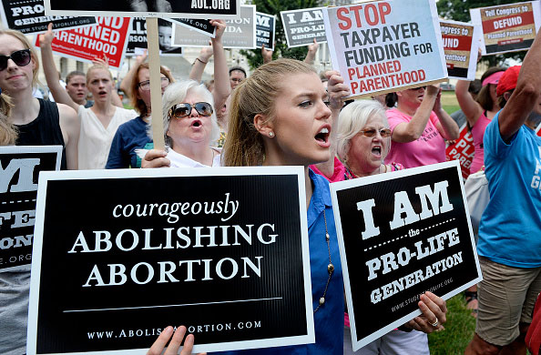 Anti-abortion activists hold a rally July 28 opposing federal funding for Planned Parenthood in front of the U.S. Capitol in Washington, D.C. 