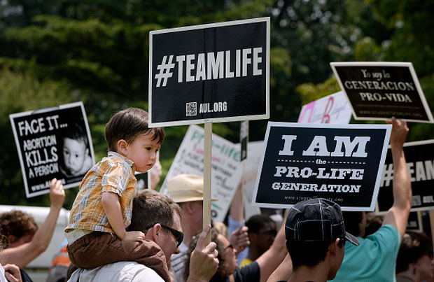 Anti-abortion activists hold a rally July 28 opposing federal funding for Planned Parenthood in front of the U.S. Capitol. 