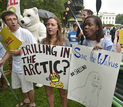 Demonstrators take part in the Shell No Day of Action to protest against arctic drilling across from the White House in Washington, D.C. President Barack Obama  gave final approval for arctic drilling this week.
