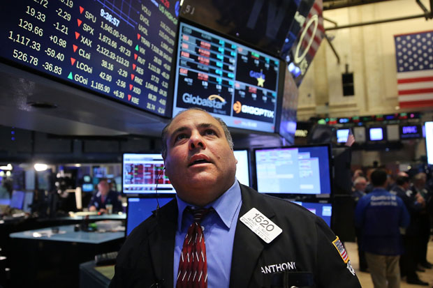 A trader works Aug. 24 on the floor of the New York Stock Exchange (NYSE)  in New York City. As the global economy continues to react from events in China, markets dropped significantly around the world. 