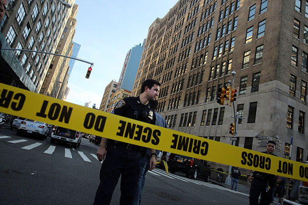 Police cordon off a crime scene where two people were shot Aug. 21 in New York City.   
