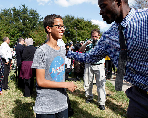 Fourteen-year-old Ahmed Ahmed Mohamed is greeted by a supporter during a Sept. 16 news conference on in Irving, Texas. Mohammed was detained after a high school teacher falsely concluded that a homemade clock he brought to class might be a bomb.