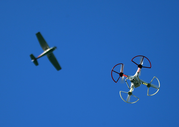 A drone is flown for recreational purposes as an airplane passes nearby in the sky above Old Bethpage, New York, on Sept. 5.