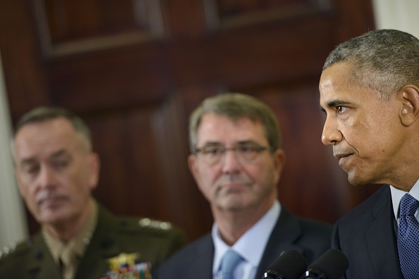 President Obama, right, speaks Oct. 15 at the White House about his plan to keep thousands of U.S. troops in Afghanistan. Marine Gen. Joseph F. Dunford — the chairman of the Joint Chiefs of Staff — and Defense Secretary Ashton Carter, center, listen in.