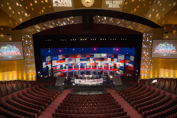 Workers test the setup at the Milwaukee Theater for Tuesday night's Republican presidential debate sponsored by Fox Business News and the Wall Street Journal. 