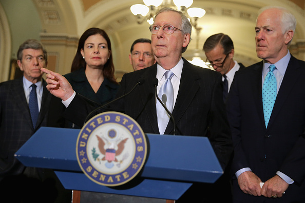 Senate Majority Leader Mitch McConnell (R-Ky.), center, and fellow GOP leaders talk to reporters on Tuesday. The Senate passed a defense authorization bill by a vote of 91-3, sending it back to President Obama with language that would make it hard for him to close the Guantanamo Bay prison before he leaves office in 2017. 