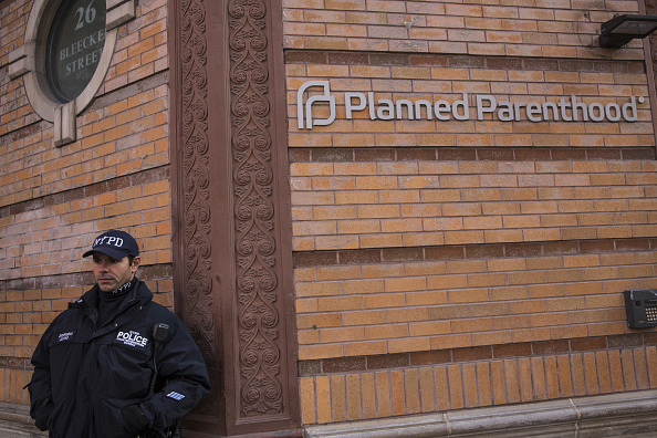 A New York City police officer from the counterterrorism department stands guard outside a Planned Parenthood location in the city on Monday. Gov. Andrew Cuomo ordered increased security at Planned Parenthood offices throughout the state.