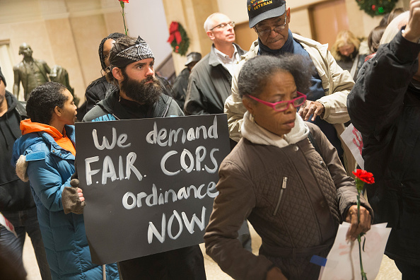 Demonstrators protest Tuesday outside the office of Chicago Mayor Rahm Emanuel at City Hall after the mayor announced the firing of Police Superintendent Garry McCarthy.