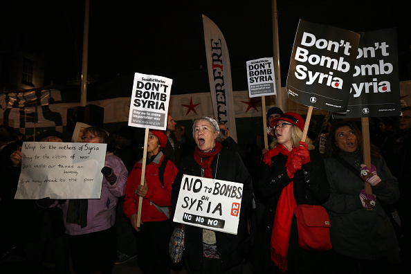 Demonstrators protest outside Parliament on Wednesday against British airstrikes on Islamic State targets in Syria. British lawmakers endorsed airstrikes Wednesday night, and Royal Air Force jets began making runs in Syria early Thursday. 