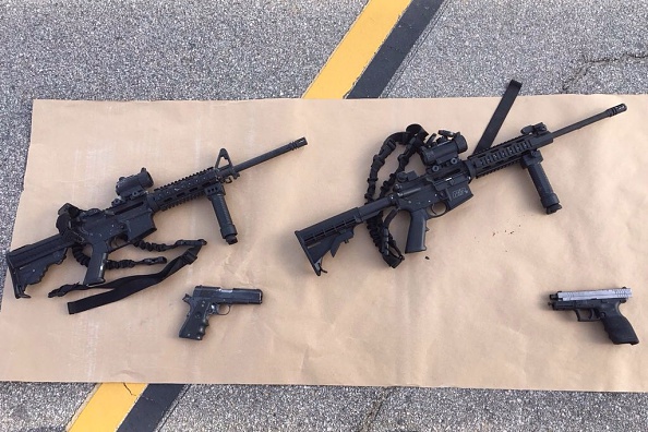 In this handout photo provided by the San Bernardino County Sherrif's Department, four guns are seen near the site of a shootout between police and suspects in the San Bernardino shootings.