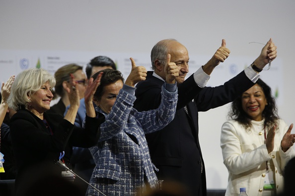 Thumbs are up at the close of the COP21 international climate negotiations on Saturday. Left to right: The French ambassador for the negotiations, Laurence Tubiana; the executive secretary of the U.N. Framework Convention on Climate Change, Christiana Figueres; and the French foreign affairs minister Laurent Fabius, who was president-designate of the conference. 