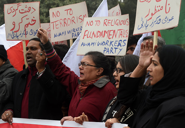 Pakistani human rights activists shout slogans against a militant attack on a university during a demonstration in Lahore on Thursday.