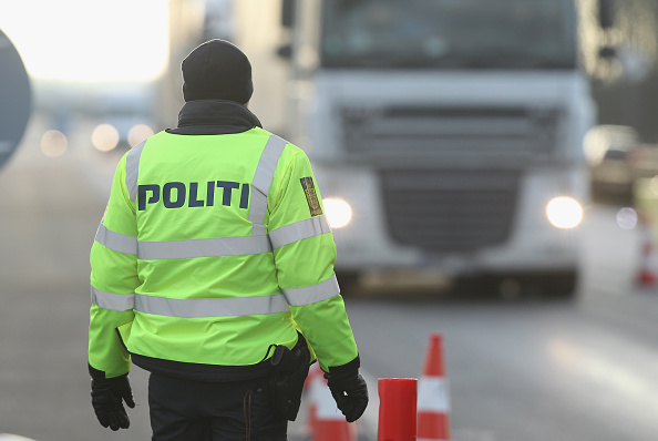 A Danish policeman conducting spot checks on incoming traffic from Germany stands at the A7 highway border crossing on Jan. 6 near Padborg, Denmark.