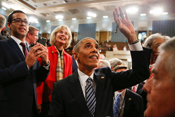 Obama waves as he walks back up the aisle at conclusion of his speech Tuesday night.