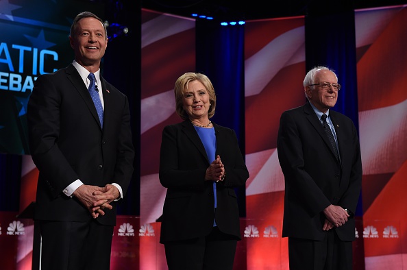 From left, O'Malley, Clinton and Sanders arrive onstage before Sunday's debate.