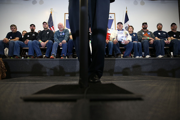 People listen as Democratic presidential candidate Bernie Sanders speaks during a campaign event with United Steelworkers Local 310L on Tuesday in Des Moines, Iowa.