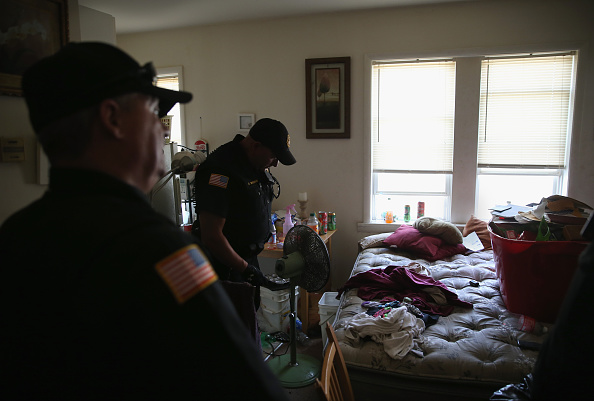 Atlantic County Sheriff's office deputies arrive to evict tenants during foreclosure proceedings in Pleasantville, New Jersey in August 2015. Eviction has increased dramatically in recent decades, Matthew Desmond writes in his new book.