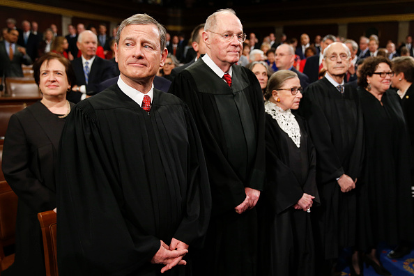 The Supreme Court Justices arrive before the State of the Union address to a joint session of Congress on Capitol Hill January 12 in Washington, D.C.
