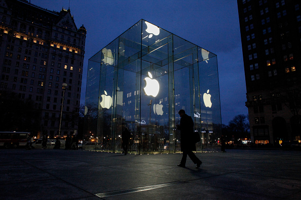 A man walks outside the Apple store on the Fifth Avenue in New York on February 17. Apple's challenge of a court order to unlock an iPhone used by one of the San Bernardino killers opens up a new front in the long-running battle between technology companies and the government over encryption.