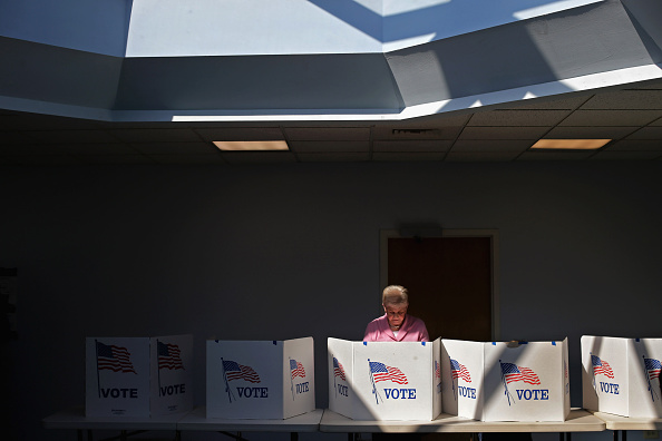 Voters cast their ballots at the polling place at Fairfax Circle Baptist Church during Super Tuesday voting March 1 in Fairfax, Virginia.