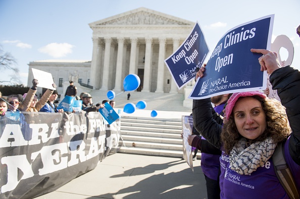 Supporters of legal access to abortion (right), as well as anti-abortion activists (left), rally outside the Supreme Court on March 2 as the Court hears oral arguments in the case of Whole Woman's Health v. Hellerstedt, which deals with access to abortion.