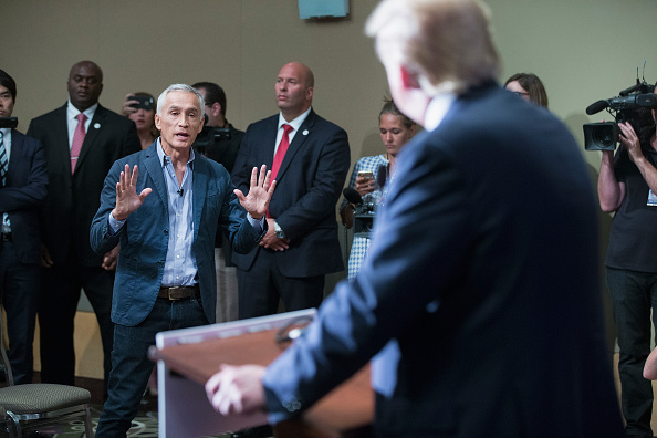 Univision and Fusion anchor Jorge Ramos asks Republican presidential candidate Donald Trump a question during a press conference on August 25, 2015 in Dubuque, Iowa. Earlier in the press conference Trump had Ramos removed from the room when he failed to yield when Trump wanted to take a question from a different reporter.