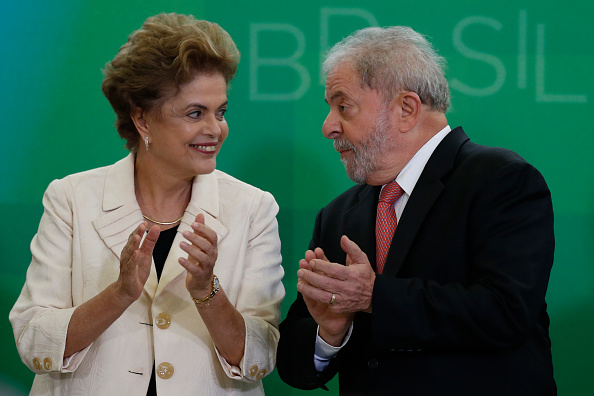 Brazil's former president, Luiz Inacio Lula da Silva (R), is sworn in as the new chief of staff for embattled President Dilma Rousseff on March 17 in Brasilia, Brazil. His controversial cabinet appointment comes in the wake of a massive corruption scandal and economic recession in Brazil.