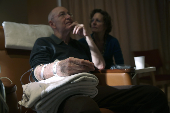 Youssef Cohen, 68, sits while undergoing cancer treatment as his wife Lindsay Wright looks on, on March 17 in New York City. He is currently taking immunotherapy infusions of the drug Keytruda in a final effort to fight his incurable cancer called mesothelioma.