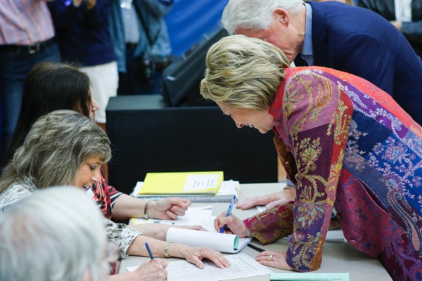 Democratic presidential candidate Hillary Clinton and her husband, former President Bill Clinton, arrive to cast their ballots at a polling station during the New York State presidential primaries on April 19 in Chappaqua, New York.