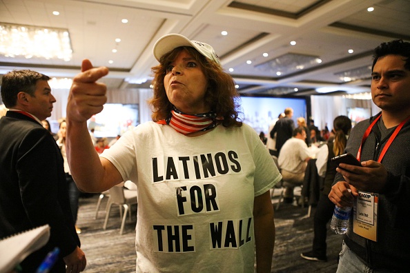 Republican presidential candidate Donald Trump supporter Luisa Aranda gestures as she is interviewed before Trump speaks at the California Republican Party 2016 convention in Burlingame, California on April 29. 
Hundreds of protesters jostled with police in riot gear outside a California hotel where Republican presidential frontrunner Donald Trump was to give a speech, forcing the candidate to duck into a back entrance.
