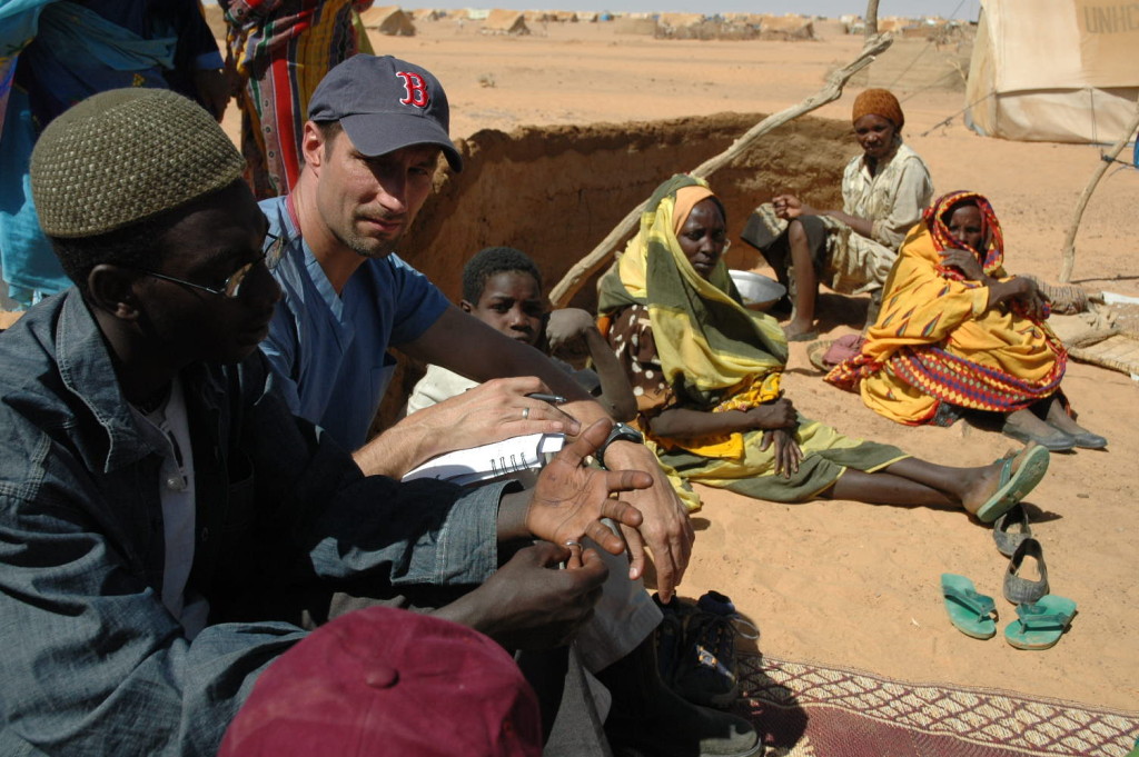 Michael VanRooyen interviewing Darfuri refugees at Kashuni Camp, Chad in 2005.