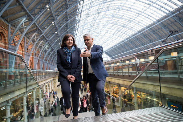 Mayor of London Sadiq Khan (R) speaks with Mayor of Paris Anne Hidalgo as they meet at St. Pancras Station in London on May 10.