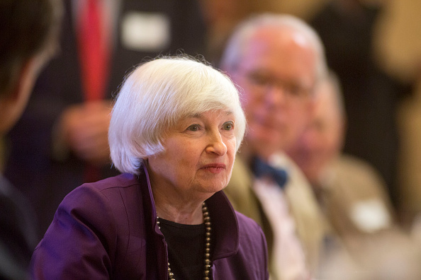 Federal Reserve Chair Janet L. Yellen, second from left, visits with attendees before giving a speech on economic outlook and monetary policy on June 6 in Philadelphia, Pennsylvania.
