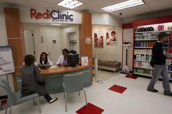 A woman consults nurses at a RediClinic, which offers low-cost examination and treatments for minor illnesses often half the cost of a regular doctor's visit, inside of a Duane Reade drugstore October 6, 2006 in New York City.