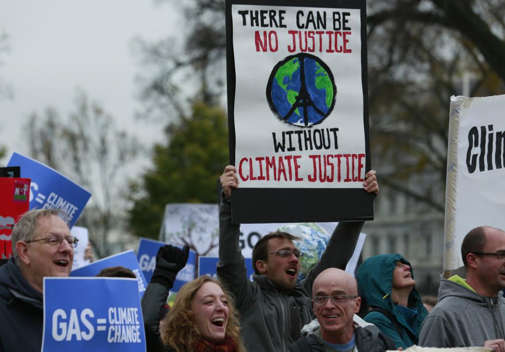 Protesters rally about climate change outside the White House in Washington, DC on November 29, 2015. Hundreds of thousands of people rallied around the world on the eve of a Paris summit aimed at averting catastrophic climate change.   